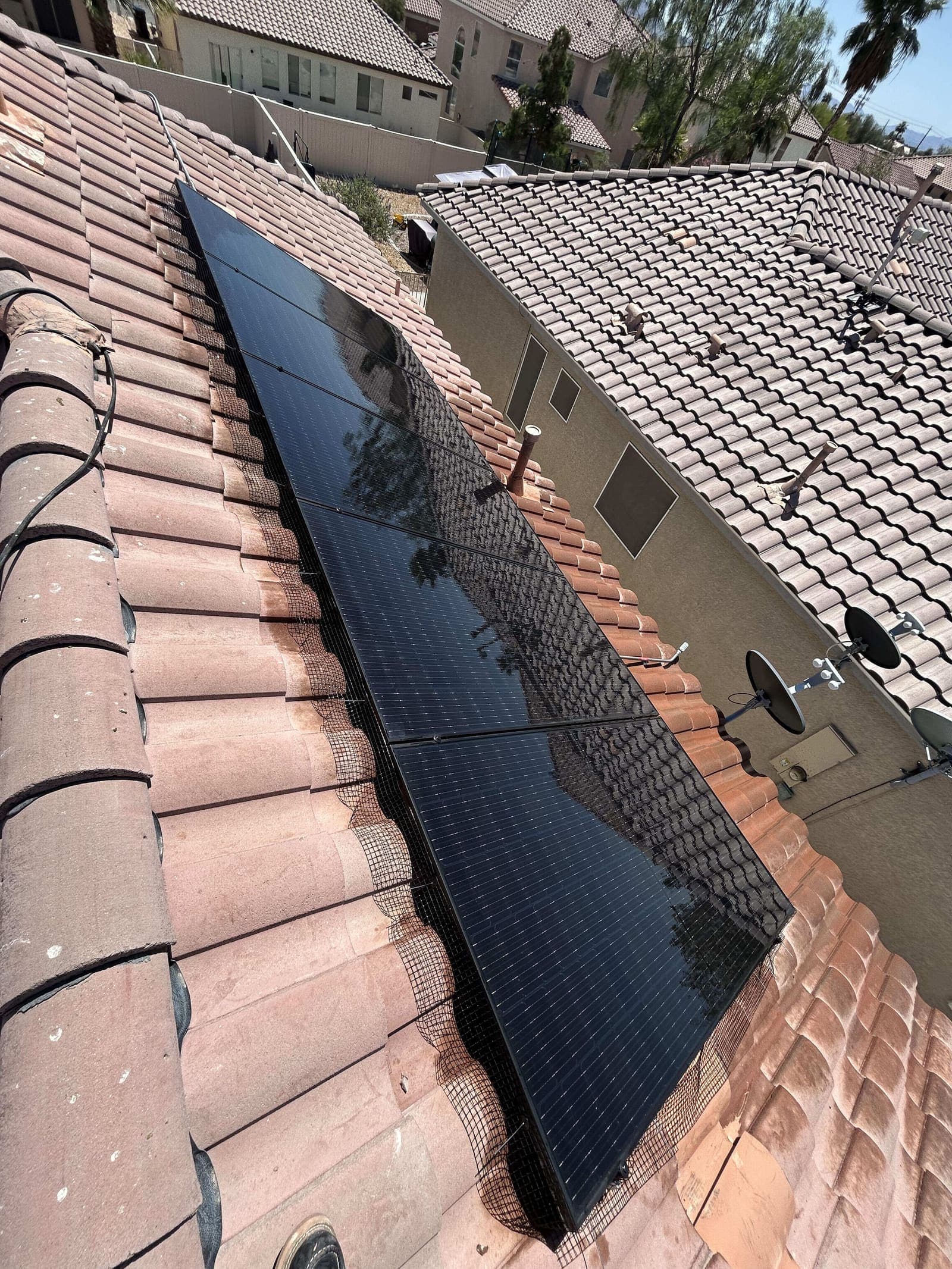 Finished bird mesh installation over solar panels